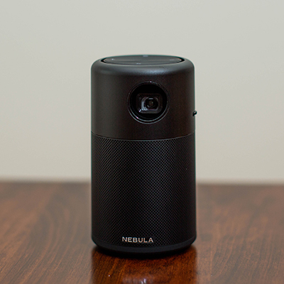 NEBULA<sup>&reg;</sup> by ANKER Capsule - This most advanced pocket cinema allows you to stream your favorite content from video streaming apps or mirrors your phone screen to create detailed picture up to 100". Also features omni-directional sound, Android 7.1 OS, 4-hour continuous video playtime and broad connectivity.  4.72"H x 2.67"D and weighs 14.8 oz.  Includes Nebula Capsule, power adaptor, manual and remote.