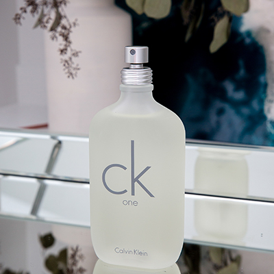 ck ONE<sup>&reg;</sup> by Calvin Klein - This revolutionary ck fragrance was designed for men and women to share. Includes notes of pineapple, mandarin orange, jasmine, rose, sandalwood and cedar to name just a few to create an effect of fullness and warmth. 6.7 fluid ounces.