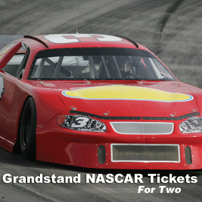 Grandstand NASCAR<sup>&reg;</sup> Tickets - Imagine you and a friend at one of NASCAR's exciting races.  It's the ultimate racing fan experience!  Includes 2 grandstand tickets. Race to be determined based on scheduling. Airfare not included. 
