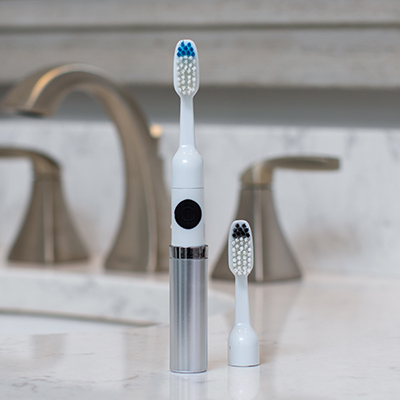 VIVITAR<sup>&reg;</sup> Ultrasonic Toothbrush - This compact and lightweight, battery operated toothbrush performs 22,000 strokes per minute for quality teeth care.  Features include replaceable brush head, cap for protecting germs and bacteria, and one AAA battery.